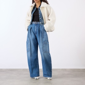 Model wearing Max Mara Sportmax Midnight Blue wide-leg cargo trousers, styled with cream jacket and black top