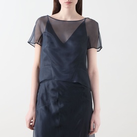 Model wearing Piano Forte Mela Organza Top in Midnight Blue; sheer silk layer over cami base, round neck, short sleeves, styled with matching skirt