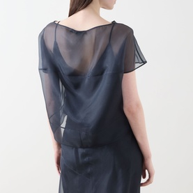 Model wearing Piano Forte Mela Organza Top in Midnight Blue, sheer silk organza layer over cami base, viewed from behind