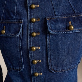 Polo Ralph Lauren blazer in Roserea Wash denim, close-up detail of antique brass dome buttons and twin chest patch pockets