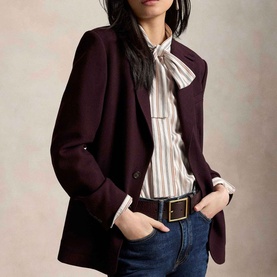 Model wearing Polo Ralph Lauren Midnight Merlot blazer, styled with striped shirt, black belt and blue jeans.