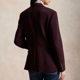 Model wearing Polo Ralph Lauren Midnight Merlot blazer, rear view, styled with blue jeans and white collared shirt.
