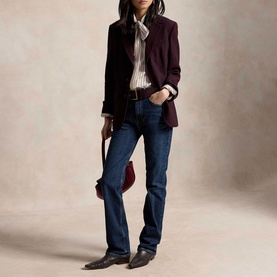 Model wearing Polo Ralph Lauren Midnight Merlot blazer with striped shirt, dark jeans, and western boots, carrying a small red bag.