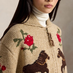 Model wearing Polo Ralph Lauren Multi cardigan with floral and dog intarsia knit pattern, styled with white turtleneck