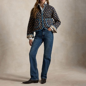 Model wearing Polo Ralph Lauren Navy Multi jacket with blue trim, styled with white shirt, blue jeans and dark cowboy boots