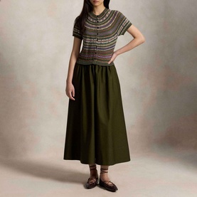 Model wearing Polo Ralph Lauren Hybrid Fair Isle Flared Dress in Olive Multi, with Fair Isle knit bodice, A-line skirt, styled with dark flat shoes