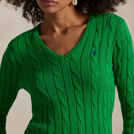 Model wearing Polo Ralph Lauren Preppy Green cable-knit V-neck sweater with navy embroidered pony logo