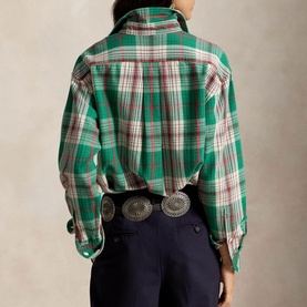 Model wearing Polo Ralph Lauren green and cream plaid shirt, back view, styled with navy trousers and silver concho belt