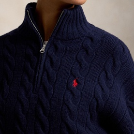 Model wearing Polo Ralph Lauren Hunter Navy cable-knit half-zip jumper with red pony logo embroidery.