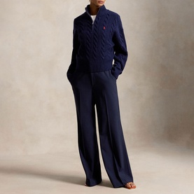 Model wearing Polo Ralph Lauren Hunter Navy cable-knit half-zip jumper with wide-leg trousers
