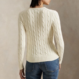 Model wearing Polo Ralph Lauren Authentic Cream cable-knit jumper, back view, styled with blue denim jeans.
