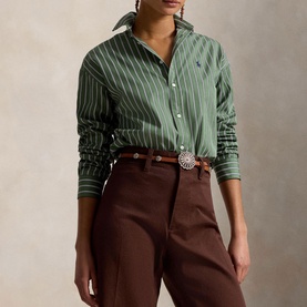 Model wearing Polo Ralph Lauren green and white striped shirt with brown wide-leg trousers and a silver brooch belt