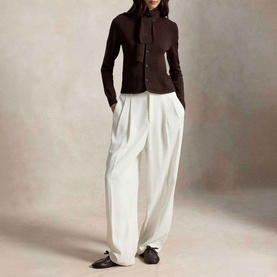 Model wearing Polo Ralph Lauren Deep Chocolate Melange knit cardigan, styled with white wide-leg trousers and black loafers.