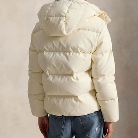 Model wearing Polo Ralph Lauren Estate Cream puffer coat with hood, cropped silhouette, styled with blue jeans, rear view.