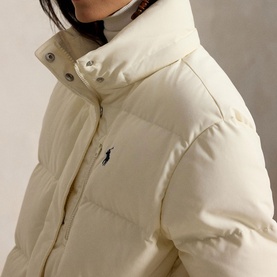 Model wearing Polo Ralph Lauren Estate Cream puffer coat with funnel neck, snap collar detail and embroidered pony logo