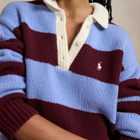 Model wearing Polo Ralph Lauren knit sweater in Harvardwne, bold burgundy and blue stripes, cream collar, embroidered polo pony logo