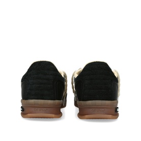 Off-White black suede trainers, rear view showing heel counter, cream ankle lining, and gum rubber sole