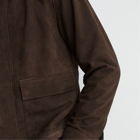 Reiss dark brown suede jacket close-up showing flap chest pocket and zip fastening detail