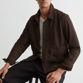 Model wearing Reiss dark brown suede-effect jacket with spread collar and front patch pockets, styled with grey T-shirt and black trousers