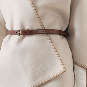 Max Mara Accessories camel virgin wool cape with contrast blanket-stitch trim, styled with a tan leather belt with gold buckle.