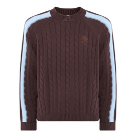 Pellador Overlap Cable Knit Sweater in brown, crew neck, cable knit structure, light blue double-stripe sleeves, embroidered logo detail