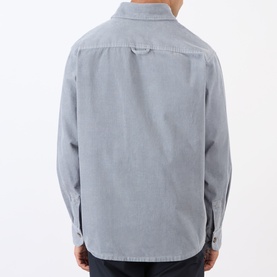 Model wearing A.P.C. blue grey cotton casual shirt, rear view showing relaxed fit and long sleeves