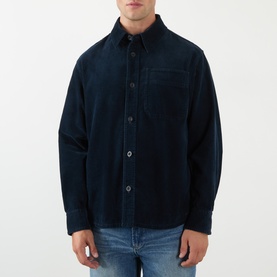 Model wearing A.P.C. Patch Pocket Corduroy Shirt in dark navy with point collar, chest patch pocket, and front button fastening, styled with blue