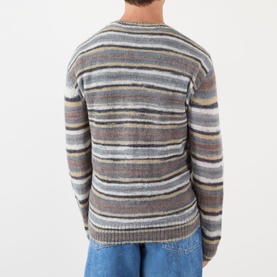 Model wearing A.P.C. grey striped mohair-alpaca crew neck jumper, back view, styled with blue jeans