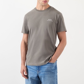 Model wearing A.P.C. T-Shirt in Gris Tahiti, grey cotton crew neck with small chest logo, styled with blue jeans.