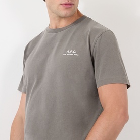 Model wearing A.P.C. T-shirt in Gris Tahiti, featuring small logo print at chest, crew neck and short sleeves in cotton jersey.