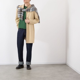 Model wearing A.P.C. dark green cotton T-shirt, styled with beige overcoat, checked scarf, dark jeans and black leather shoes.
