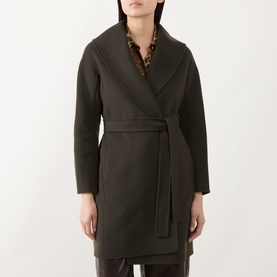 Model wearing Max Mara S kaki wool wrap coat with shawl collar and self-tie belt, styled over a leopard-print top.