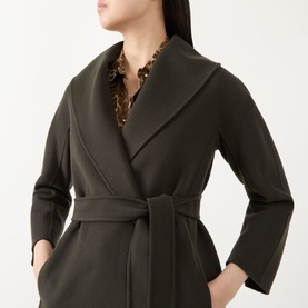 Model wearing Max Mara S kaki virgin wool belted coat with shawl collar, styled with a gold chain necklace.