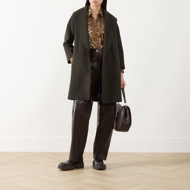 Model wearing Max Mara S kaki virgin wool coat, styled with leopard print blouse, dark leather trousers, chunky black loafers and brown top-handle