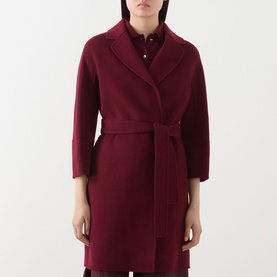 Model wearing Max Mara S bordeaux wool wrap coat with tie belt, shawl collar, and 3/4-length sleeves, styled with a matching shirt.