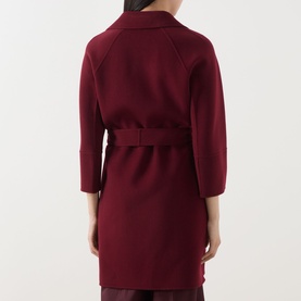 Model wearing Max Mara S bordeaux virgin wool coat, rear view, featuring belted waist and raglan sleeves