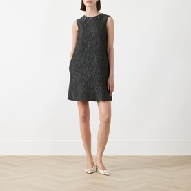 Model wearing Max Mara S Vicolo Jacquard Mini Shift Dress in dark green, sleeveless with crew neckline and textured finish, styled with gold flat