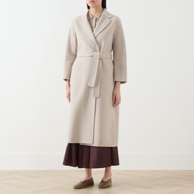 Model wearing Max Mara S Esturia Belted Wrap Coat in beige, longline wool style with notched lapels and self-fabric belt, styled with burgundy skirt