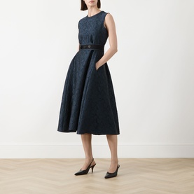 Model wearing Max Mara S Midnight Blue jacquard midi dress with full skirt and belt, styled with black slingback heels
