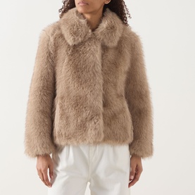 Model wearing Max Mara S Malce Faux-Fur Short Coat in Honey, featuring shirt collar and wide fit, styled with white trousers.