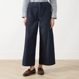 Model wearing Max Mara S Jour Wide-Leg Joggers in midnight blue denim, styled with a grey top and brown loafers.