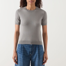 Model wearing Max Mara S Giulietta Slim Fit Sweater in light grey with short sleeves and round neck, styled with blue jeans