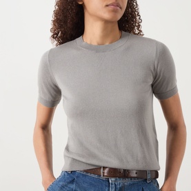 Model wearing Max Mara S Giulietta Slim Fit Sweater in light grey, short-sleeve round neck knit with ribbed trims, styled with blue jeans