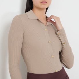 Model wearing Max Mara S Limone Knitted Polo Shirt in beige ribbed wool, with polo collar and gold-tone button fastenings.