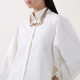 Model with Max Mara Weekend Giglio Chain Choker Necklace in gold-tone, chunky curb chain with resin beads, styled over white shirt