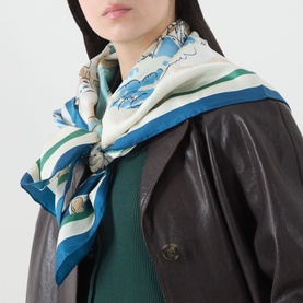 Model with Max Mara Weekend Onesto Silk Printed Scarf in China Blue, square silk scarf with floral print and solid border, styled over dark leather