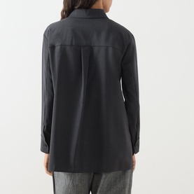Model wearing Max Mara S Opera Patch Pocket Shirt in dark grey wool, rear view showing box pleat, long sleeves and buttoned cuffs, styled with grey