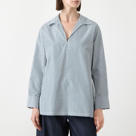 Model wearing Max Mara S Cristel Striped Shirt in dark green, open V-neck, long sleeves, high-low hem, styled with navy trousers