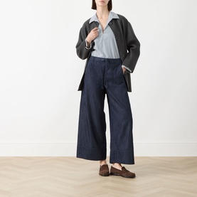 Model wearing Max Mara S Cristel Striped Shirt in dark green cotton, styled with wide-leg dark denim trousers and brown loafers.