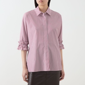 Model wearing Max Mara S Nebbie Striped Ruffle Sleeve Shirt in Bordeaux, featuring ruffle cuffs, styled with dark leather trousers.